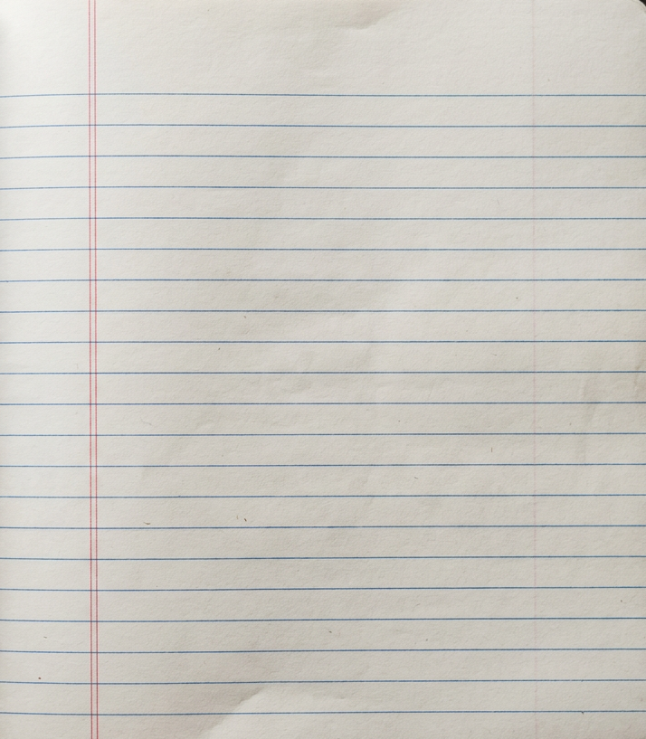 Open blank lined notebook on a wooden surface